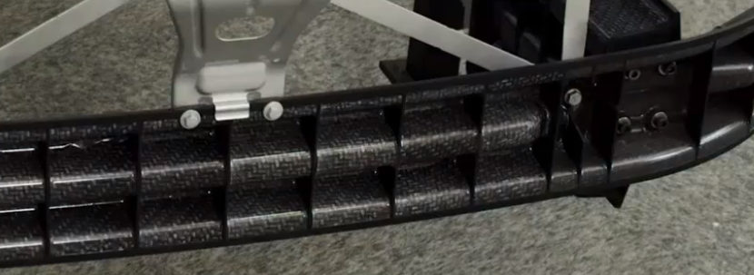 Ribbed beam with integrated mounting features